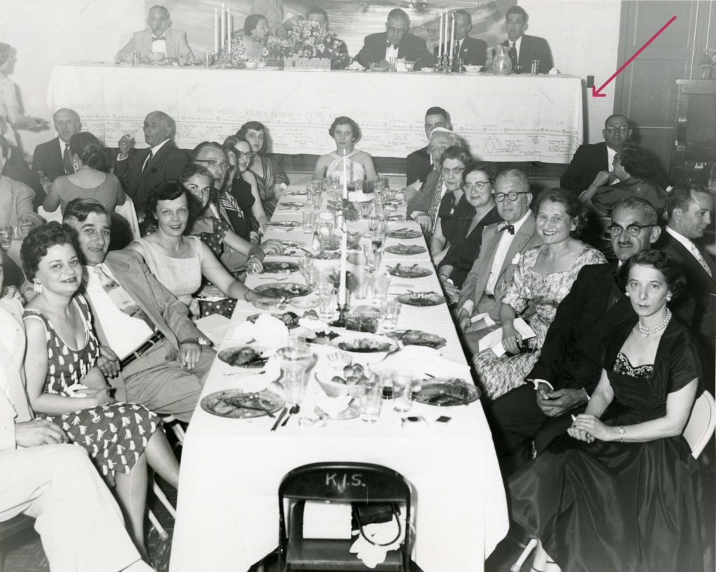 The Sisterhood of Kneseth Israel Congregation in Kittanning, PA spread its signature tablecloth across the dais at a banquet for the dedication of its new synagogue in June 1954. Image courtesy Rauh Jewish History Program & Archives.) 